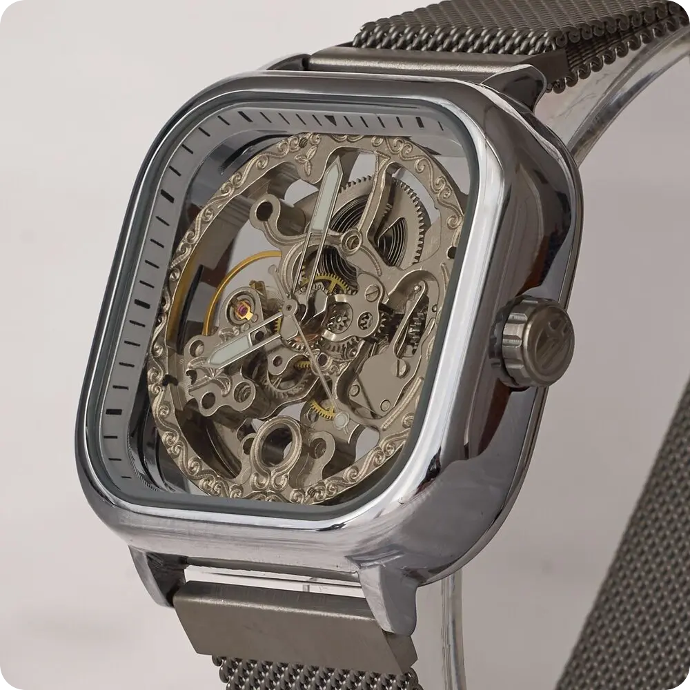 A Twofourtyseven skeleton watch with a square case and mesh strap